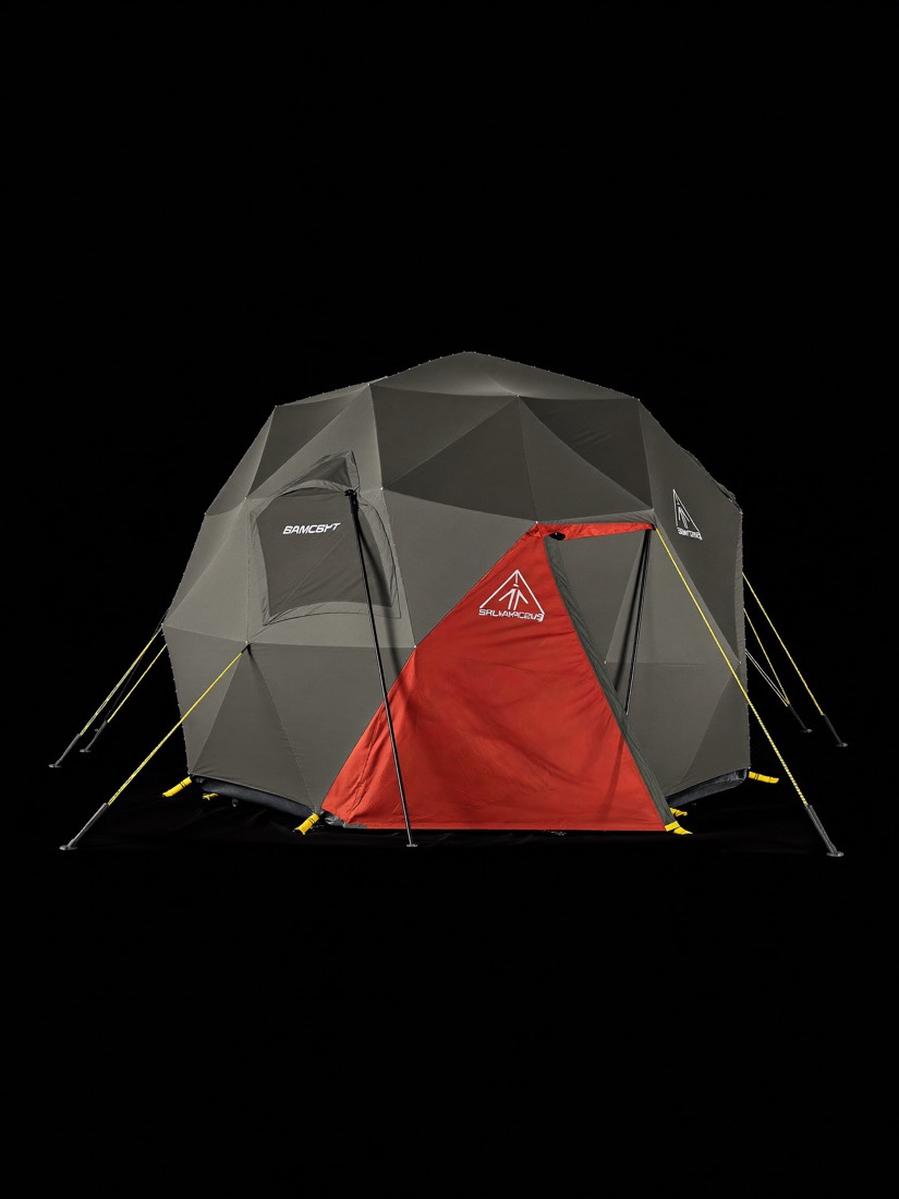 The FS-4 Basecamp shelter, a four-person dome with a tall porch, anchored on a glacier.