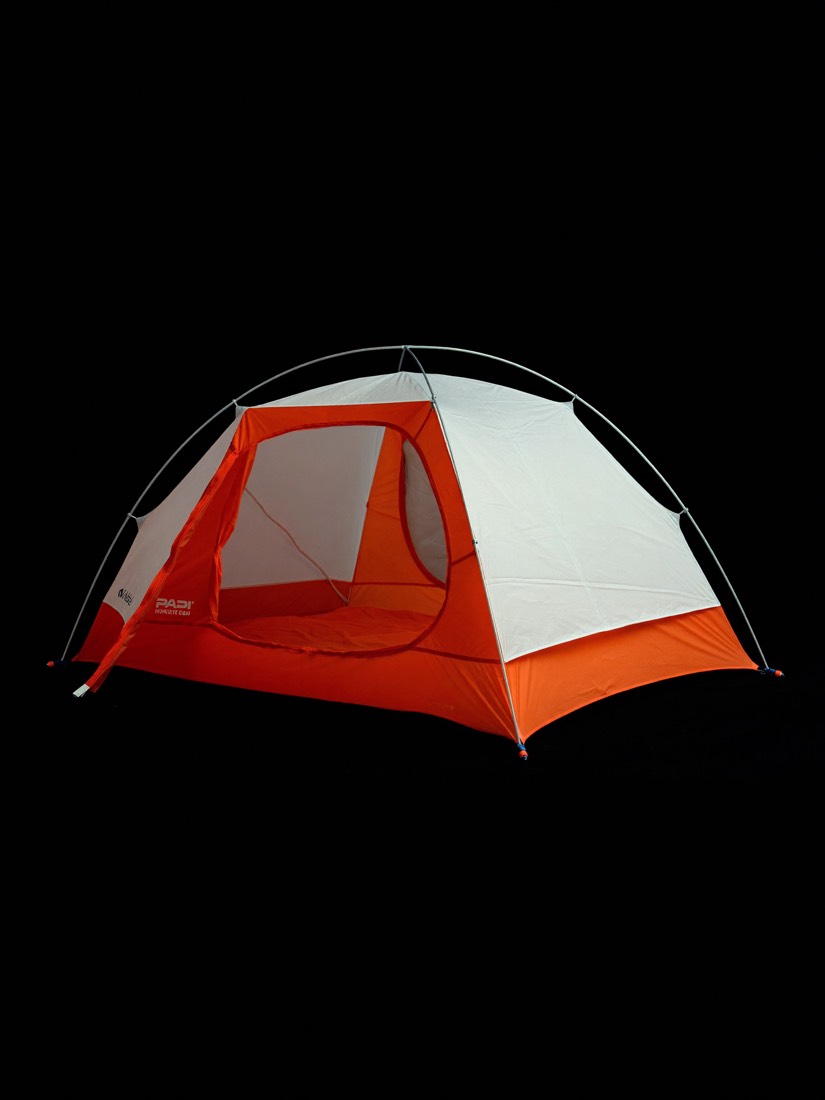 The FS-1 Solo shelter, a compact single-person tent, staged against bare rock.